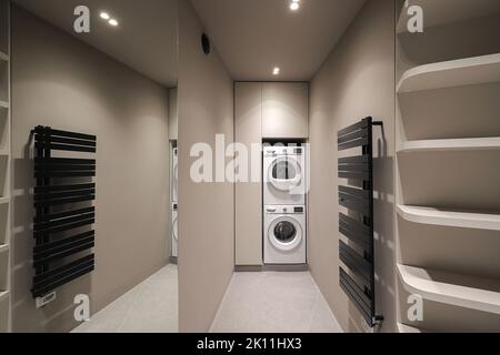 Washing machine inside empty dressing room interior Stock Photo