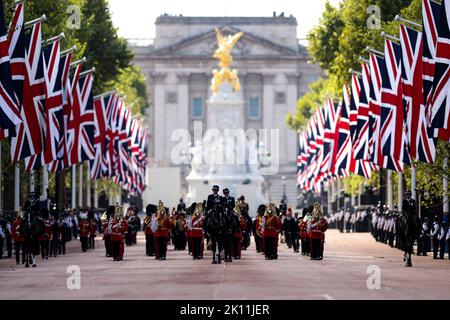 Members of the Grenadier Guards, the King's Troop Royal Horse Artillery, the Royal Household Cavalry and senior members of the Royal Family follow the coffin of Queen Elizabeth II during a procession from Buckingham Palace to Westminster Hall in London, Wednesday on September 14, 2022, where the coffin of Queen Elizabeth II, will Lie in State. Queen Elizabeth II will lie in state in Westminster Hall inside the Palace of Westminster, from Wednesday until a few hours before her funeral on Monday, with huge queues expected to file past her coffin to pay their respects. Photo by UK Minister Of Def Stock Photo