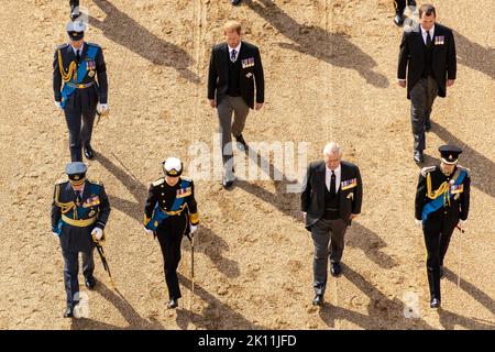 Britain's Prince William, Prince of Wales, Britain's King Charles III, Britain's Prince Harry, Duke of Sussex, Britain's Princess Anne, Princess Royal, and Vice Admiral Timothy Laurence walk behind the coffin of Queen Elizabeth II, during a procession from Buckingham Palace to the Palace of Westminster, in London on Wednesday on September 14, 2022, where the coffin of Queen Elizabeth II, will Lie in State. Queen Elizabeth II will lie in state in Westminster Hall inside the Palace of Westminster, from Wednesday until a few hours before her funeral on Monday, with huge queues expected to file pa Stock Photo