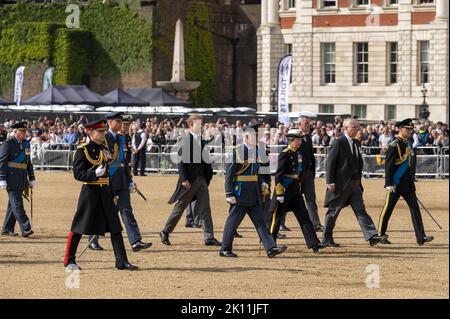 (L/R): Prince William, Prince of Wales, Prince Harry, King Charles III, Duke of Sussex, Princess Anne, Princess Royal and Vice-Admiral Sir Timothy Laurence walk behind the coffin of Queen Elizabeth II, adorned with a Royal Standard and the Imperial State Crown and pulled by a Gun Carriage of The King's Troop Royal Horse Artillery, during a procession from Buckingham Palace to the Palace of Westminster, in London on Wednesday on September 14, 2022, where the coffin of Queen Elizabeth II, will Lie in State. Queen Elizabeth II will lie in state in Westminster Hall inside the Palace of Westminster Stock Photo