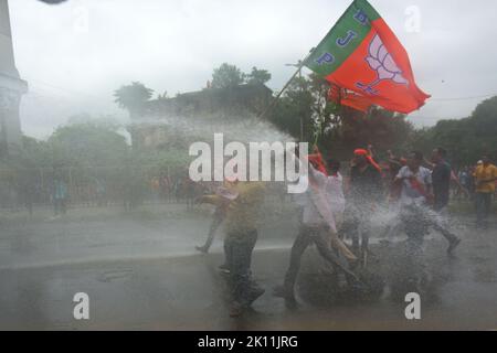 KOLKATA, INDIA - SEPTEMBER 13: Kolkata Police used water cannons to disperse Bharatiya Janata Party (BJP) supporters during a protest rally against the alleged corruption of Trinamool Congress leaders in front of Howrah Bridge on September 13, 2022 in Kolkata, India. Many BJP leaders and supporters were injured in lathi charge by police. Also number of BJP leaders, including the party's state chief Sukanta Majumdar and Suvendu Adhikari, who took part in the march, were detained by police along with their supporters. Hearing the BJP's plea against senior state government officials for proactive Stock Photo
