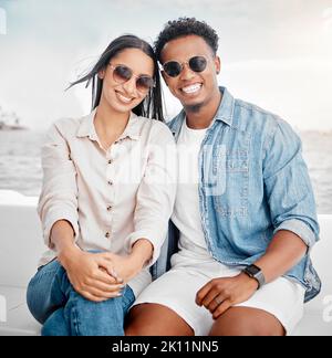 Sunglasses, summer and couple portrait at the beach for holiday, vacation with casual fashion style. Gen z or millennial woman, man or people smile Stock Photo