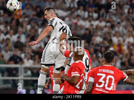 Turin, Italy. 14th Sep, 2022. Juventus' Arkadiusz Milik (top) scores during the UEFA Champions League Group H match between Juventus and Benfica in Turin, Italy, on Sept. 14, 2022. Credit: Federico Tardito/Xinhua/Alamy Live News Stock Photo