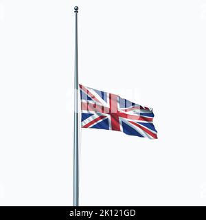 Great Britain and United Kingdom in mourning as the Union Jack flag at Half mast on the flagpole or staff day as an icon of honor.