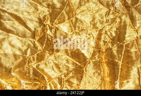 Gold background with fabric texture. High quality photo Stock Photo