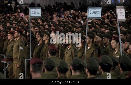 Israeli soldiers from the 35th Elite Infantry Brigade, also known as the Paratroopers Brigade, take part in a swearing ceremony for recruits who have completed their basic training at the Western Wall on September 14, 2022, in the Jerusalem, Israel. Paratrooper recruits go through a year of training that ends with a 'Beret March', where they have to finish a 90km trek. Stock Photo