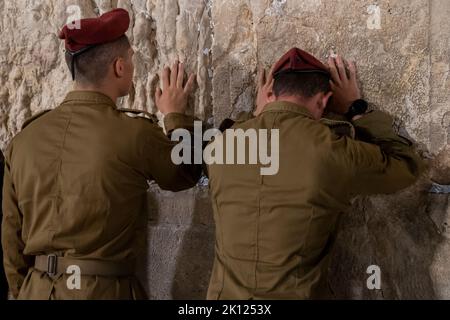 Israeli soldiers from the 35th Elite Infantry Brigade, also known as the Paratroopers Brigade, pray at the Western wall in the Jerusalem, Israel Stock Photo