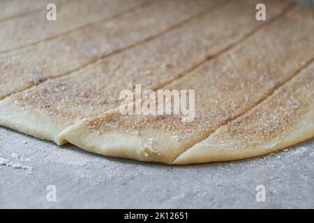 preparation of cinnamon roll dough, butter with sugar and cinnamon  Stock Photo