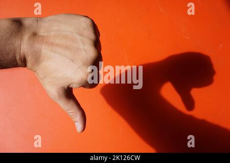 signs with various hand gestures on a red background Stock Photo