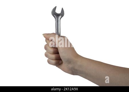 a wrench in a female hand on a white background Stock Photo