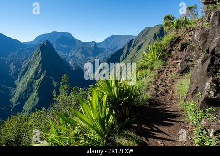 View of the mountain peaks and tourist path on the hill in Cap Noir, in Reunion Island in the summertime Stock Photo
