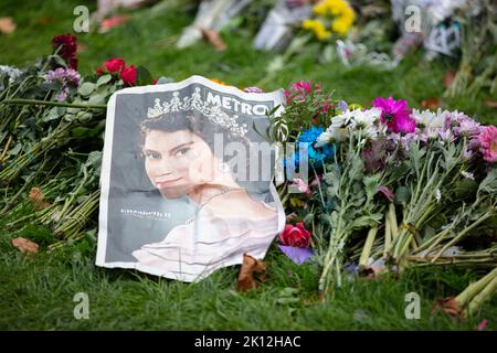 LONDON, UK - September 2022: Thousands of flowers, cards and messages are laid in Green park in tribute to Queen Elizabeth II after her death Stock Photo