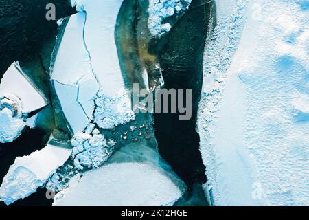 Birds view on the broken ice floes of the partly frozen Otra river during winter in Norway’s Setesdal Stock Photo