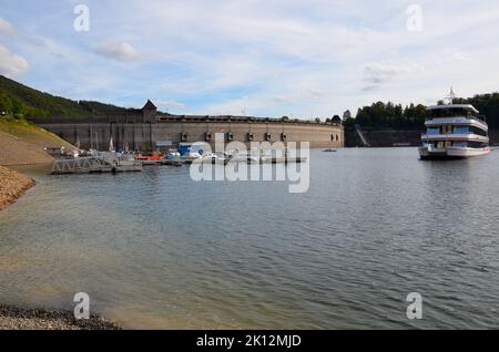 Edersee, Hessen, Germany - September 10 2011: View of a small pier at the Edersee at low tide with some fishing boats Stock Photo