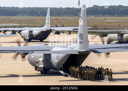Paratroopers entering a US Air Force C-130 Hercules transport plane on Eindhoven airbase. The Netherlands - September 20, 2019. Stock Photo