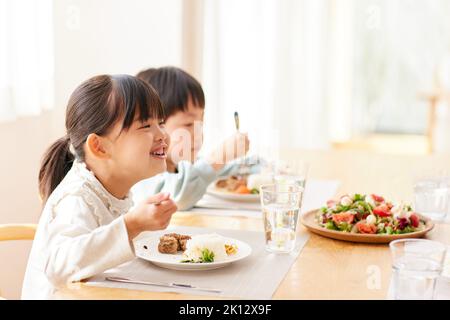 Japanese family eating together at home Stock Photo