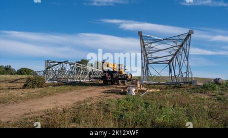 Installation assembly of Steel Tower for Transmission line for sustainable power development. Stock Photo
