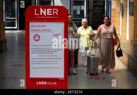 Heatwave travel advive from LNER at York Train station as people in the city of York, North Yorkshire enduring the hottest day on record as the temper Stock Photo
