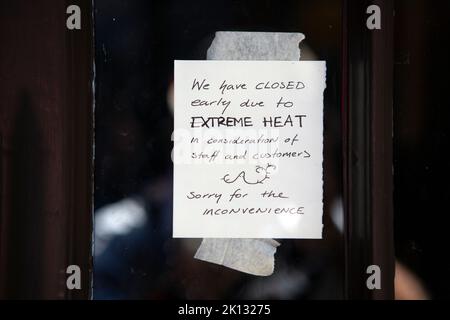 The York Ghost Mercahnts shop on the Shambles closes early due to the heat as people in the city of York, North Yorkshire endure the hottest day on re Stock Photo