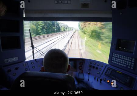 15 September 2022, Hamburg: Engine driver Rainer Dietz checks the journey in the driver's cab of a digital S-Bahn on the S2 line on its way from Bergedorf toward Berliner Tor. From September 15, digitally controlled S-Bahn trains will be running regularly on Line S2 between Berliner Tor and Bergedorf. Photo: Marcus Brandt/dpa Stock Photo