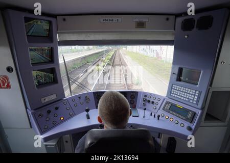 15 September 2022, Hamburg: Engine driver Rainer Dietz checks the journey in the driver's cab of a digital S-Bahn on the S2 line on its way from Bergedorf toward Berliner Tor. From September 15, digitally controlled S-Bahn trains will be running regularly on Line S2 between Berliner Tor and Bergedorf. Photo: Marcus Brandt/dpa Stock Photo