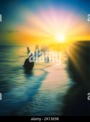 Silhouette of the 12 Apostles at sunset, Shipwreck Coast, Great Ocean Road, Victoria, Australia Stock Photo