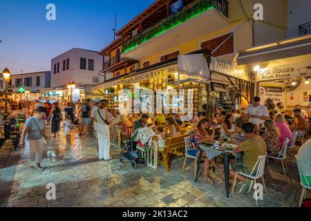 Busy street and nightlife in Skiathos Town, Skiathos Island, Sporades ...