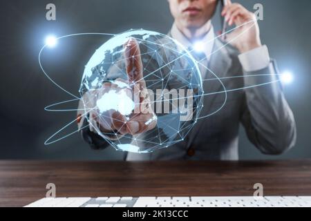 Japanese businessman with CGI world map Stock Photo