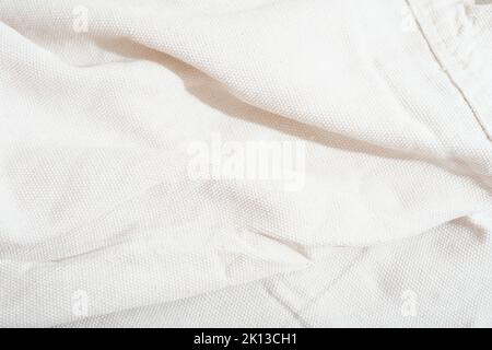 rough cotton and linen fabric, natural undyed fabric for house textile items. eco reused material. clean minimal style home design, canvas fiber. Stock Photo