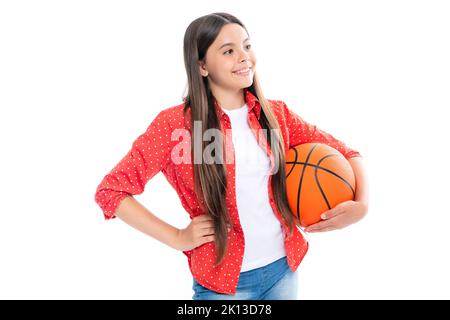 Teen girl with basketball ball isolated on white background. Portrait of happy smiling teenage child girl. Stock Photo