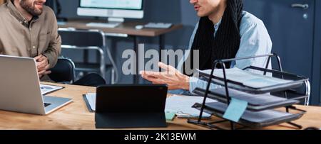 business colleagues discussing new ideas after the end of the wo Stock Photo