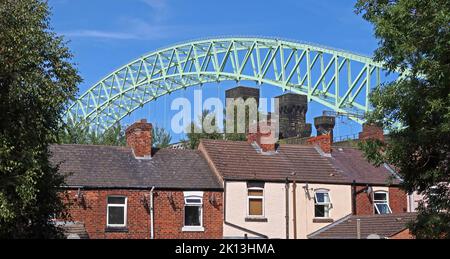 Terraced houses in Runcorn under the Silver Jubilee bridge to Widnes, Ashridge St, Runcorn old town, Halton, Cheshire, England, UK, WA7 1HU Stock Photo