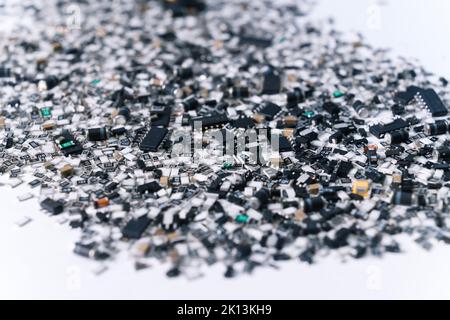 Various electrical components for circuit board mixed and scattered on white surface. Silver and black. Technology. Horizontal shot. High quality photo Stock Photo