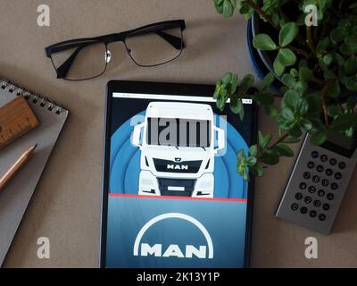 In this photo illustration, MAN Truck & Bus AG member of Traton Group logo seen displayed on a tablet. Stock Photo