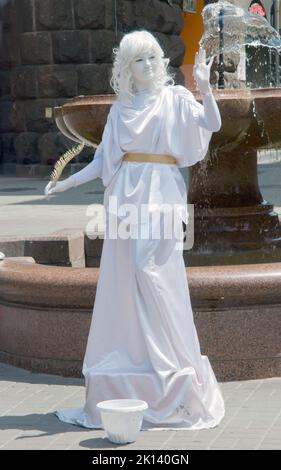 An unidentified Busking mime in white performs on Khreshchatyk street in Kiev, Ukraine Stock Photo