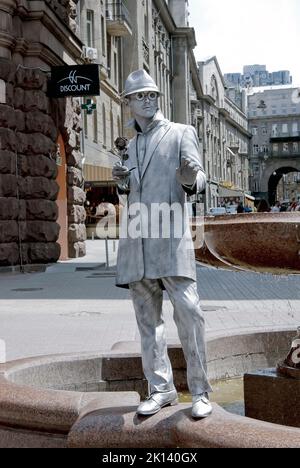 An unidentified busking mime performs on Khreshchatyk street in Kiev, Ukraine Stock Photo