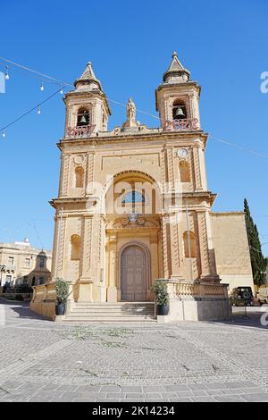 Parish church of our lady of pompei in european Marsaxlokk town in Malta, clear blue sky in 2022 warm sunny spring day on May - vertical Stock Photo