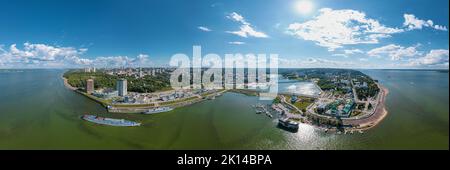 High resolution stitched panorama of a scenic aerial view of Cheboksary, capital city of Chuvashia, Russia and a port on the Volga River on sunny Stock Photo