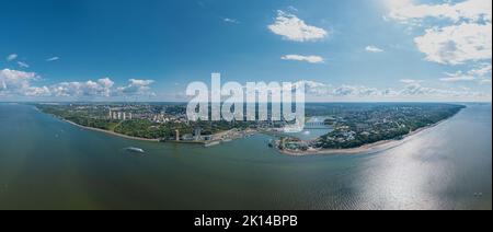 High resolution stitched panorama of a scenic aerial view of Cheboksary, capital city of Chuvashia, Russia and a port on the Volga River on sunny Stock Photo