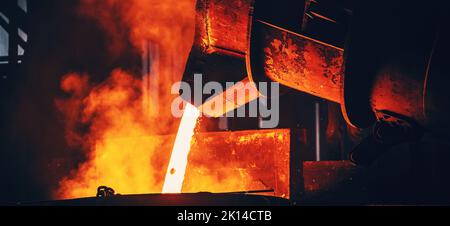 Metal casting process. Furnace in Steel Mill metallurgical factory. Horizontal banner photo. Stock Photo