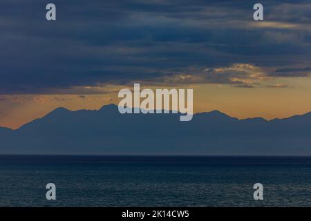 Sunset from the beach in Acharavi, Corfu island, Greece Stock Photo