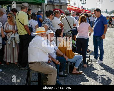 Ponte de Lima, Portugal - September 10, 2022: People waiting for one of the many parades of Feiras Novas festival Stock Photo