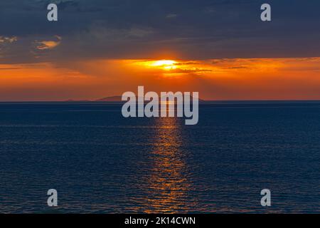 Sunset from the beach in Acharavi, Corfu island, Greece Stock Photo