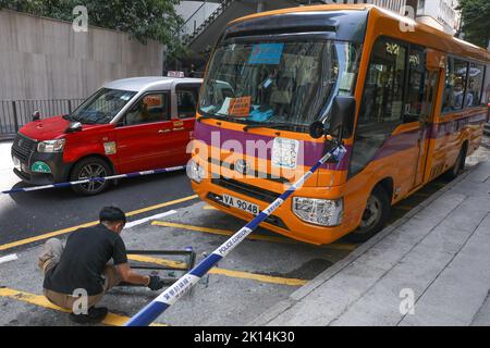 A window fell down from a residential building and hit a school bus and a woman was injured at 75 Caine Road, Central.08SEP22   SCMP/Yik Yeung-man Stock Photo