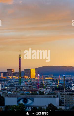 Vienna Swing Ride Wien, Vienna: last sunlight at amusement park Prater with Praterturm ...