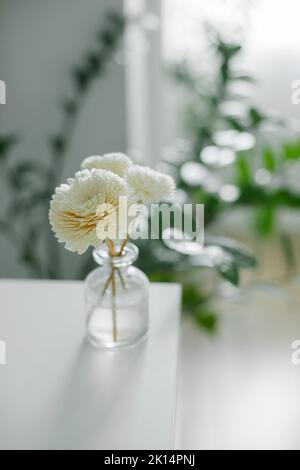 Aromatic reed air freshener on dresser. Hygge, cozy concept. Copy space. Stock Photo
