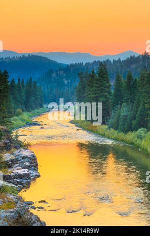 sunset over the blackfoot river in the johnsrud recreation area near potomac, montana Stock Photo