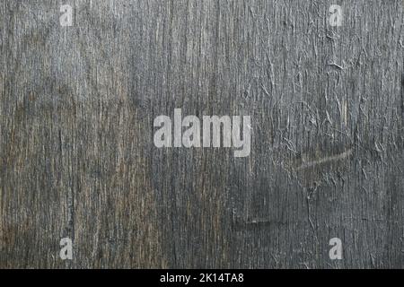 The texture of gray plywood. The texture of the smooth surface of gray plywood. Top view of the old plywood background. Stock Photo