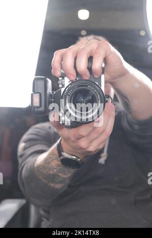 Photographer in mirror reflection Stock Photo