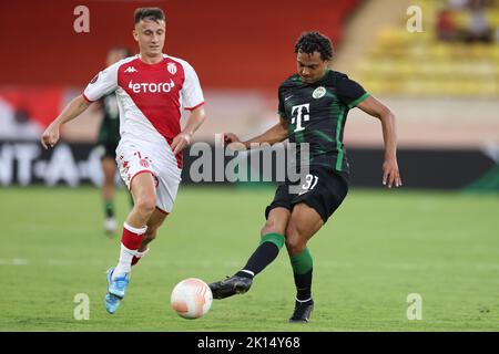 Monaco, Monaco, 15th September 2022. Henry Wingo of Ferencvaros plays the ball as Aleksandr Golovin of AS Monaco cloys in during the UEFA Europa League match at Stade Louis II, Monaco. Picture credit should read: Jonathan Moscrop / Sportimage Stock Photo